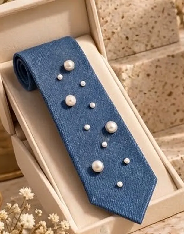 Denim necktie with pearl detailing in a presentation box
